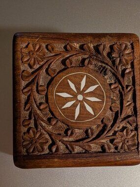 Vintage wood carved trinket box with white flower inlay and carvings